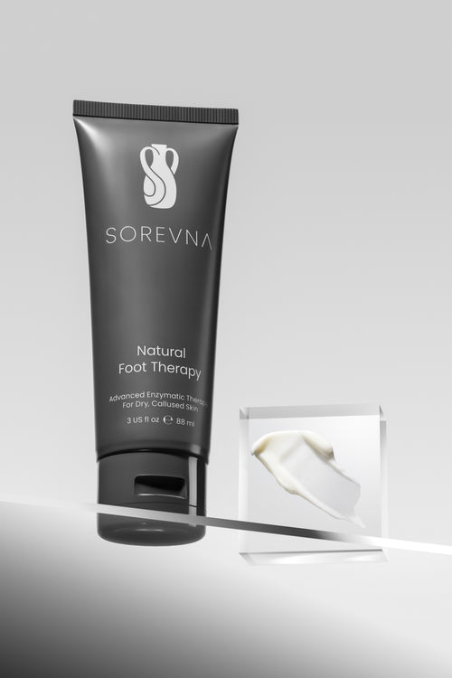 SOREVNA advanced enzymatic foot cream for callused feet, shown in a tube with rich cream texture.